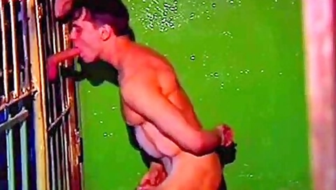 Stunning Hunk Is Sucking A Hard Boner Through The Cage